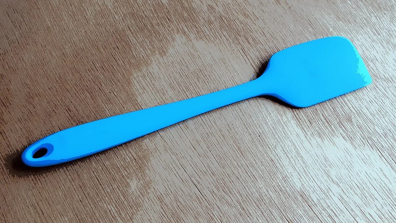 Blue spatula on a wooden surface, Israel - May 2024 03